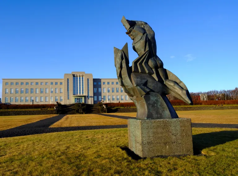 The statue Sæmundur á selnum (Sæmundur on the seal) in front of University of Iceland main building