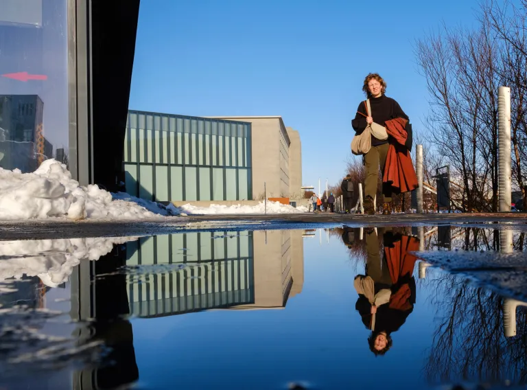Woman in front of Universiy Centre building 