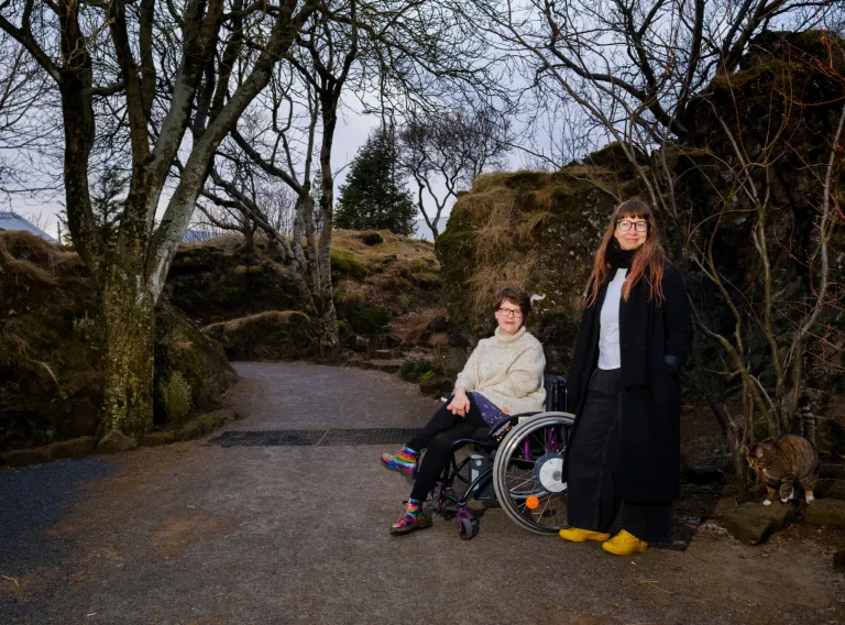 Two happy women, one in a wheelchair