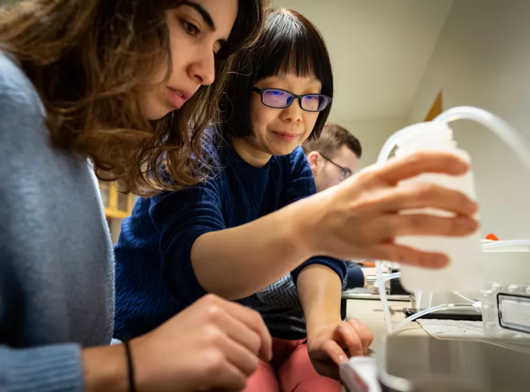 Two women in a Environmental Engineering lab. 