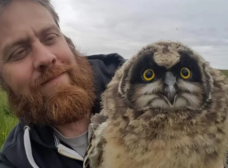 Gunnar Þór Hallgrímsson with an owl