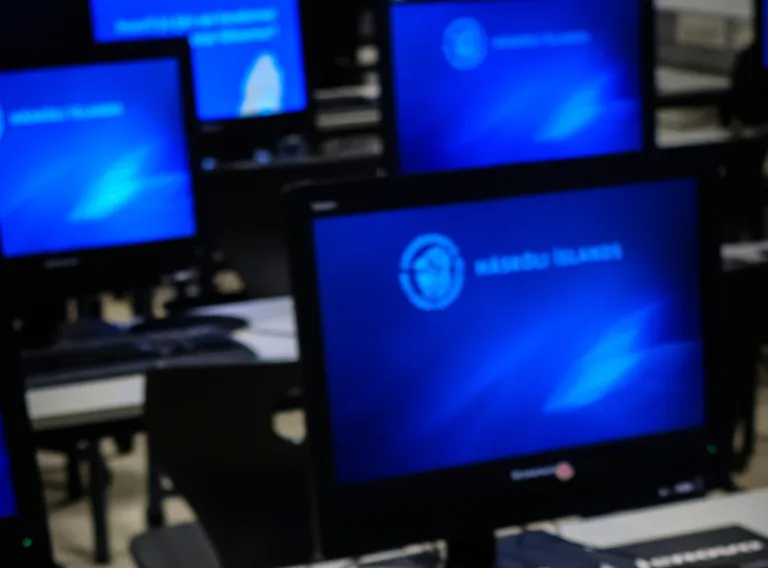 Compurters on a table and UI logo as screensaver