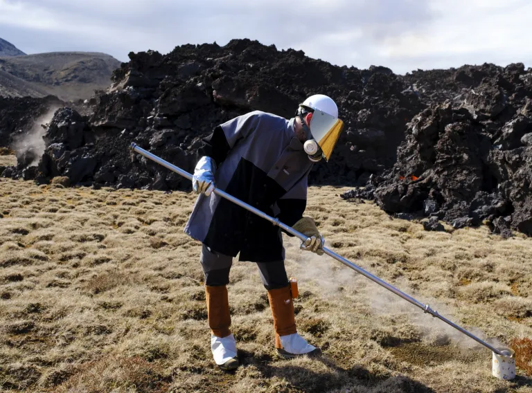 William M. Moreland collecting samples of new lava