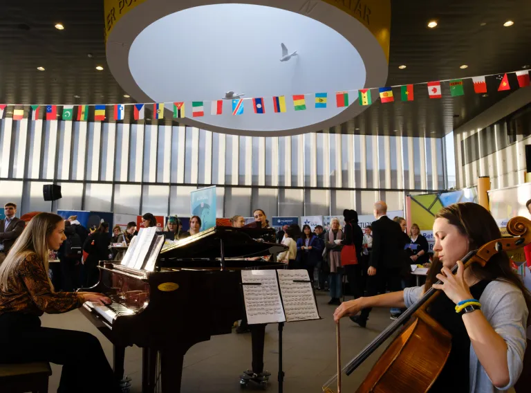 People playing piano and cello at University centre