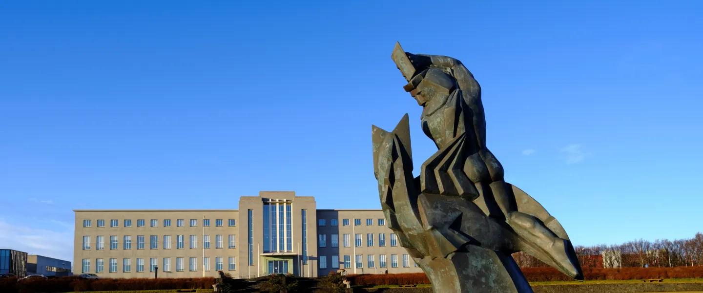 The statue Sæmundur á selnum (Sæmundur on the seal) in front of University of Iceland main building