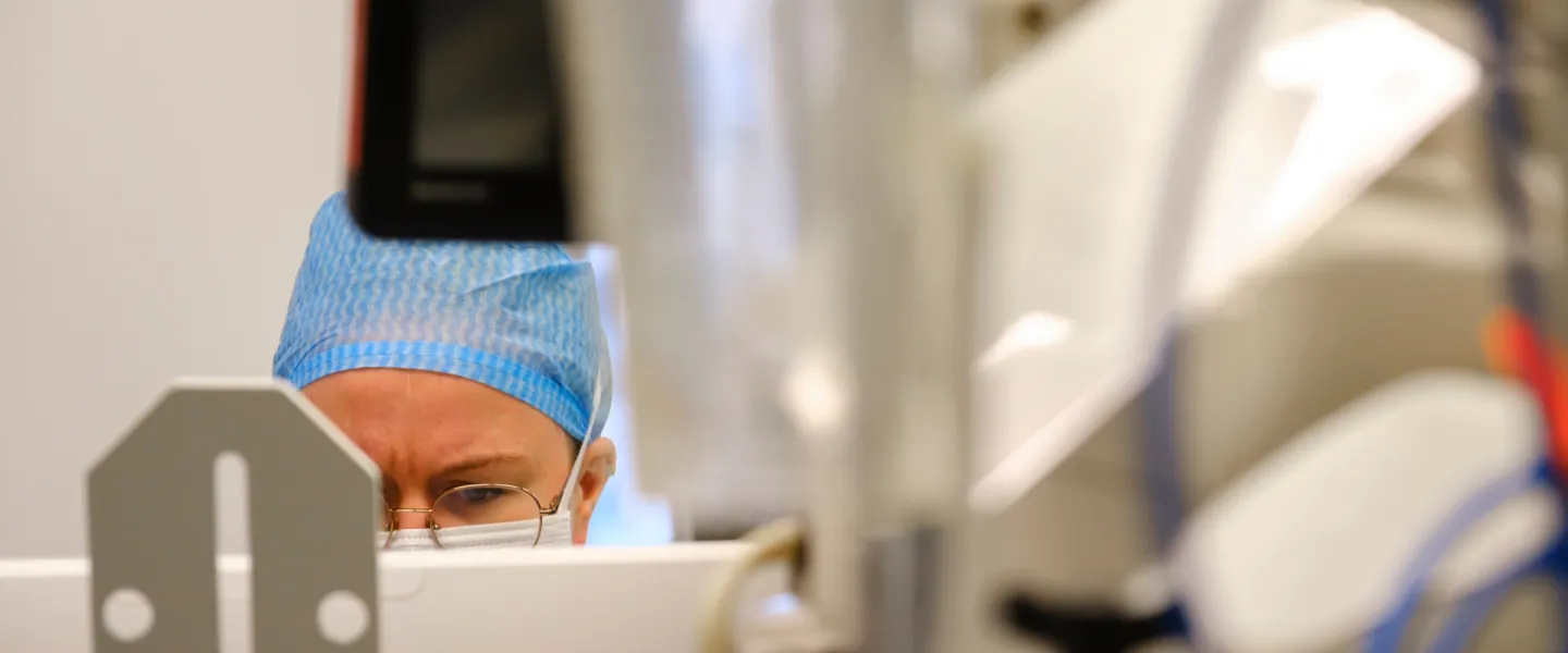 Medical doctor behind a screen