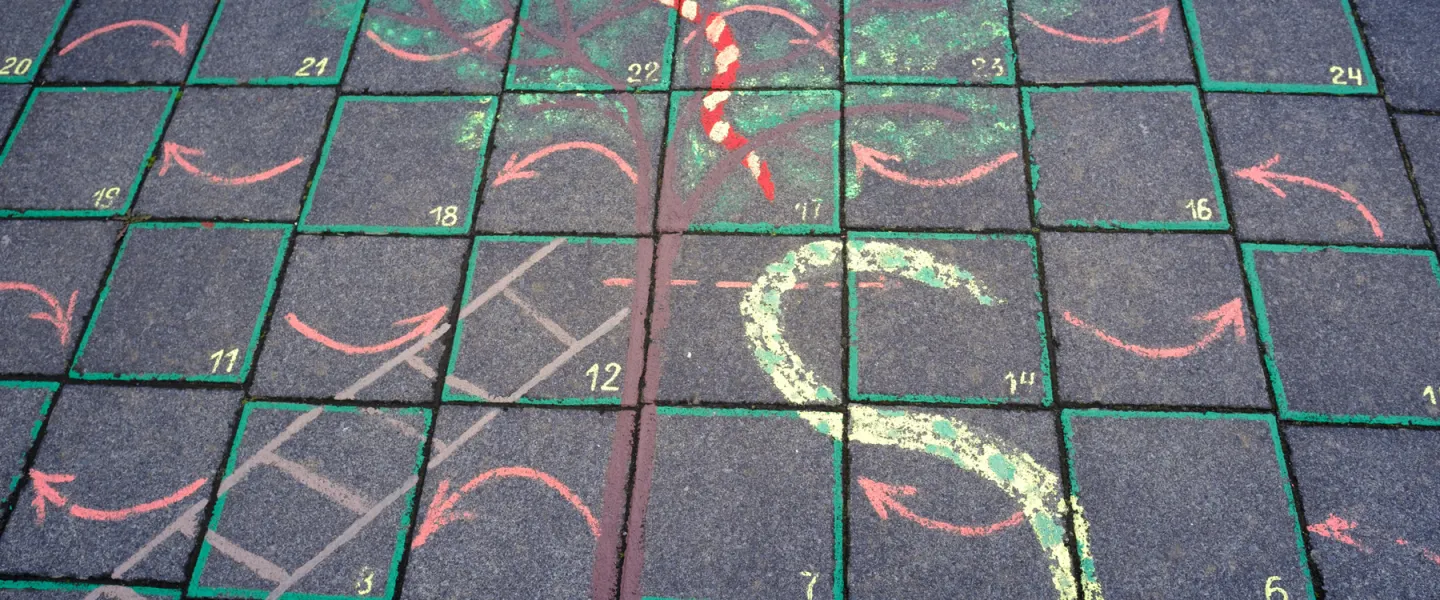 Snakes and ladders on the ground outside
