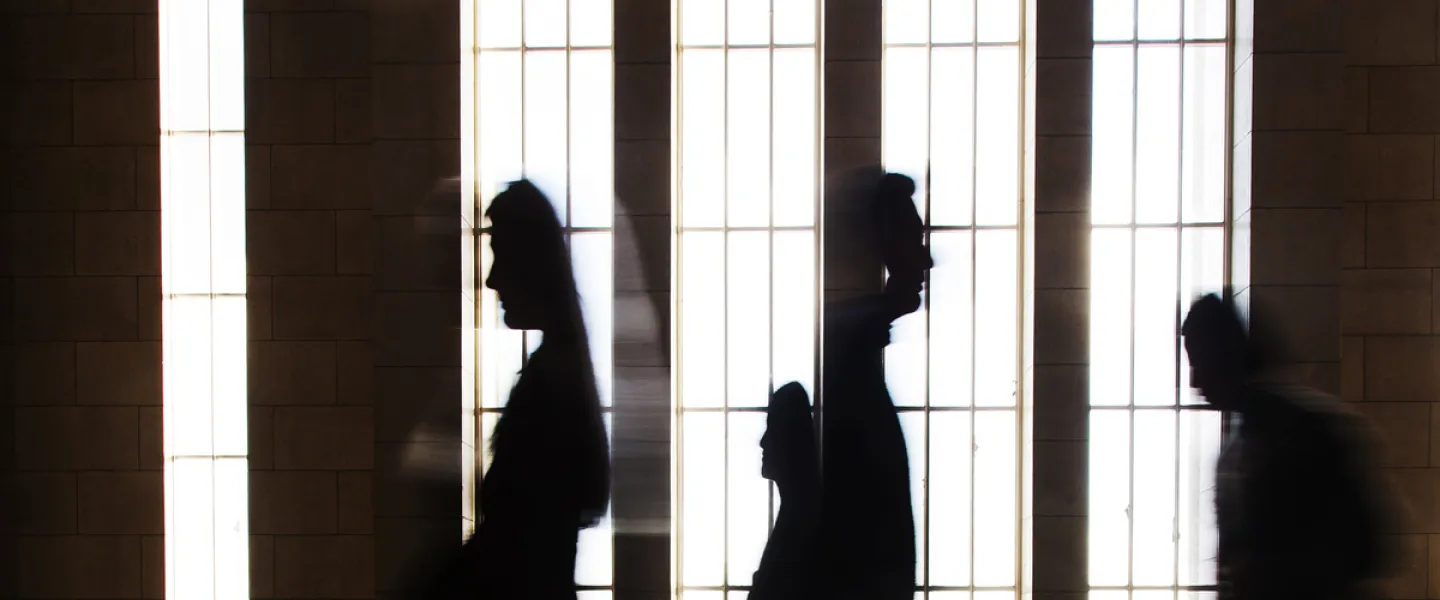 Silhouettes of people inside Main building