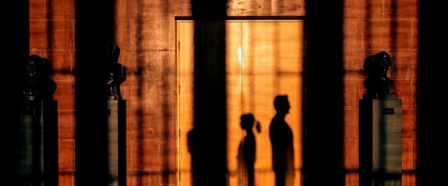 Shadows of people outside the ceremonial hall in University of Iceland main building