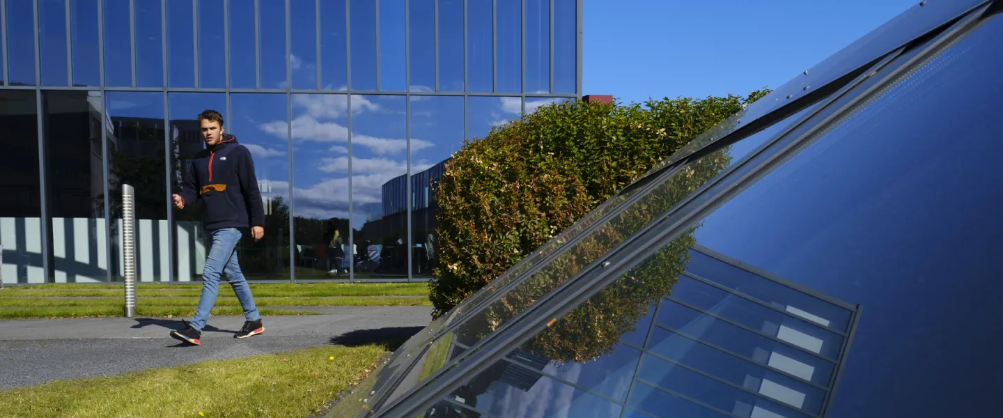 Man walking between University centre and Gimli