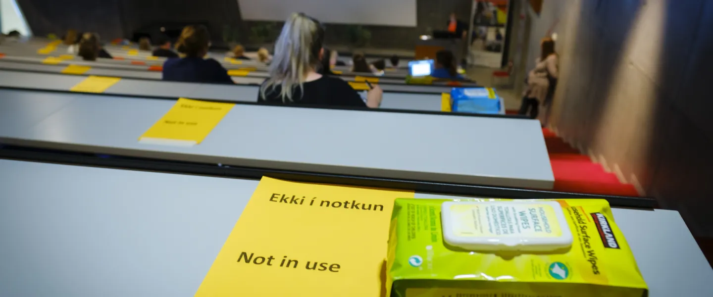 Table not in use because of covid-19 restrictions. Surface wipes on the table