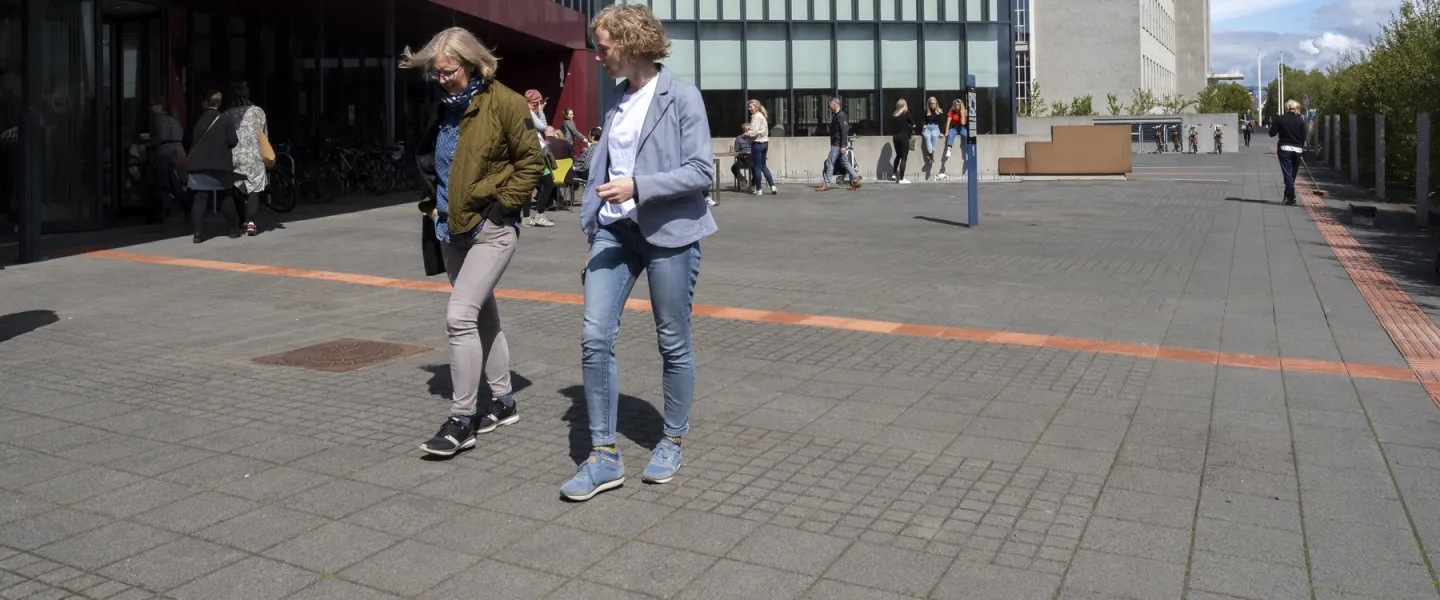 People outside of University centre in the sun