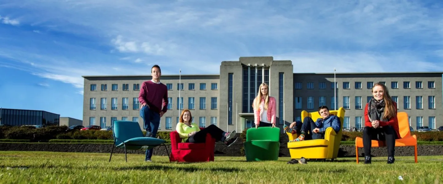Students in chairs outside of University of Iceland main building