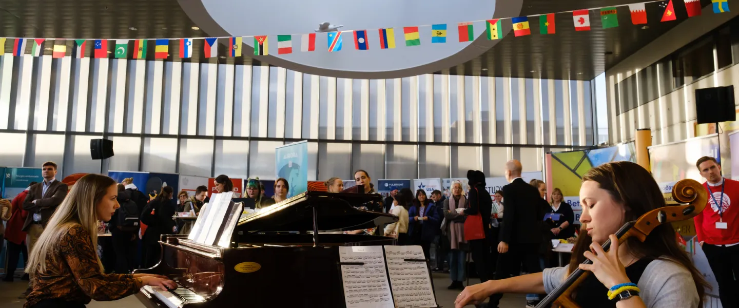 People playing piano and cello at University centre