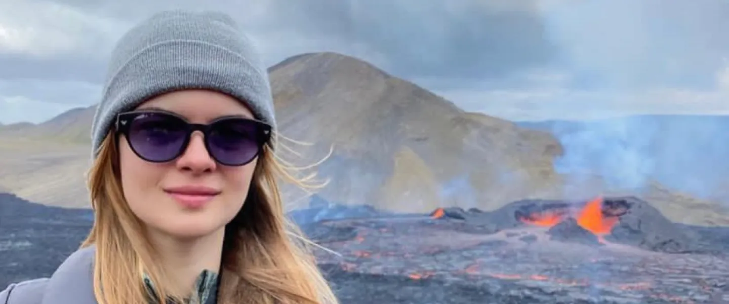 Elif Yaman, volcanic eruption in background