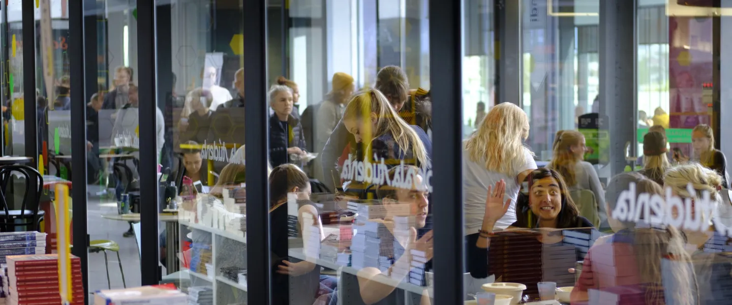People at University centre, University of Iceland, seen from the University bookstore