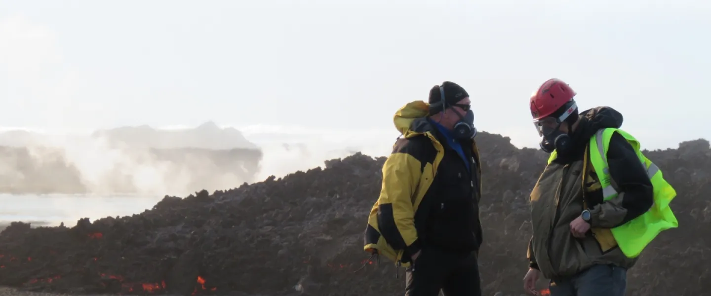 Earth scientists from University of Iceland by a fresh lava