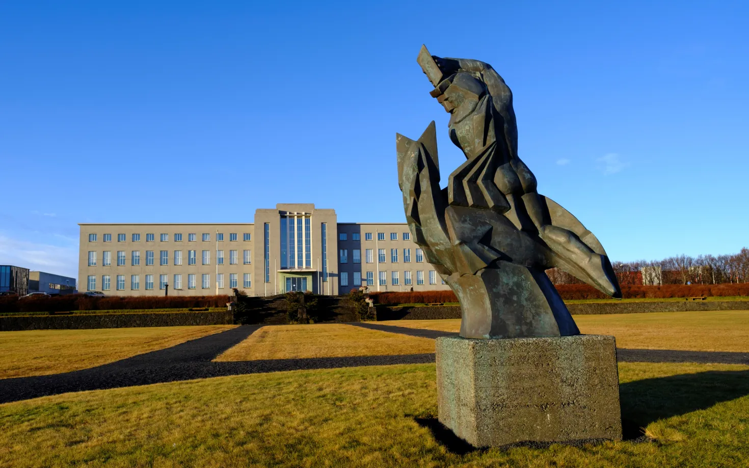 The statue Sæmundur á selnum (Sæmundur on the seal) in front of University of Iceland main building