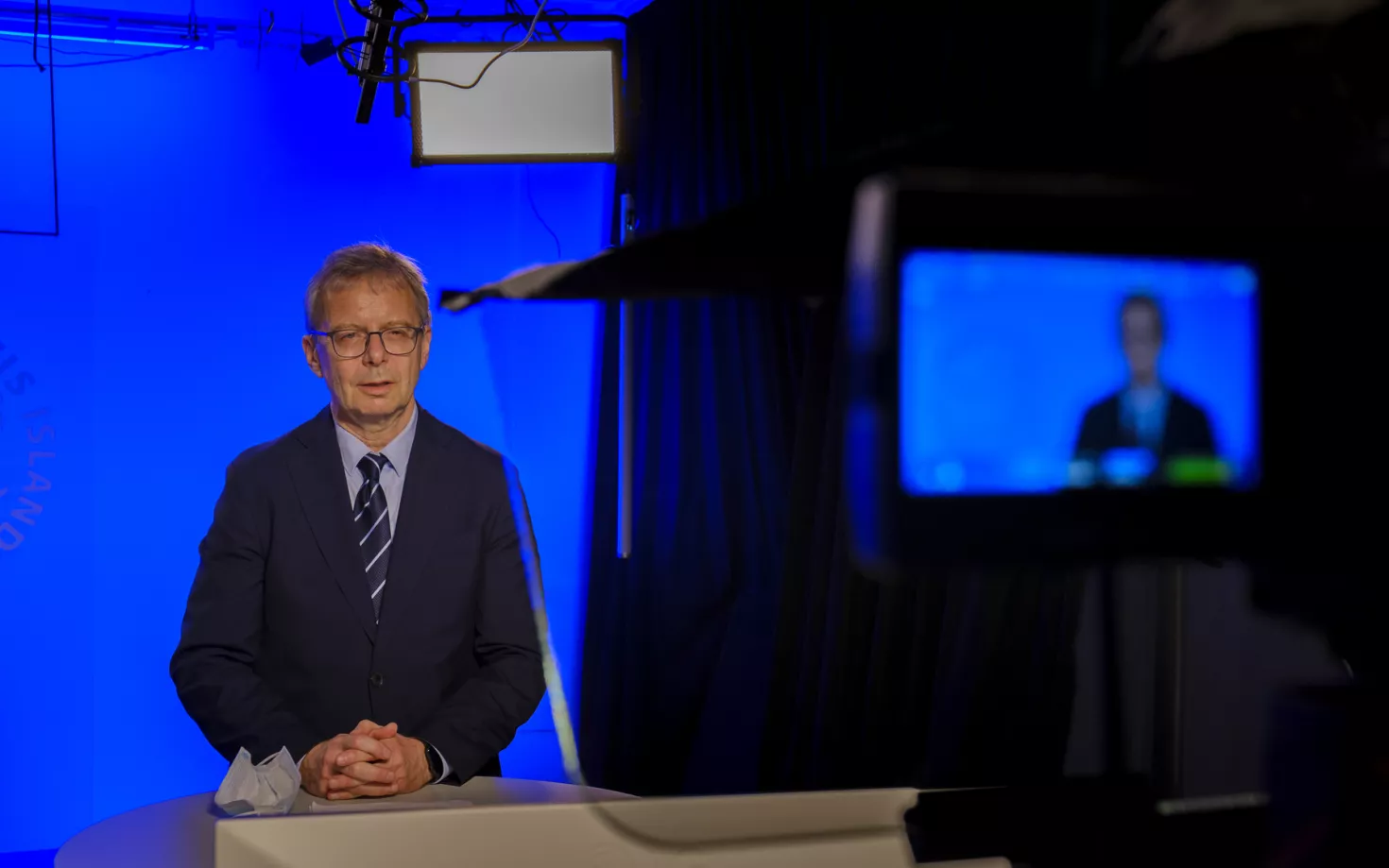 Jón Atli Benediktsson, rector of the University of Iceland, in front of a camera