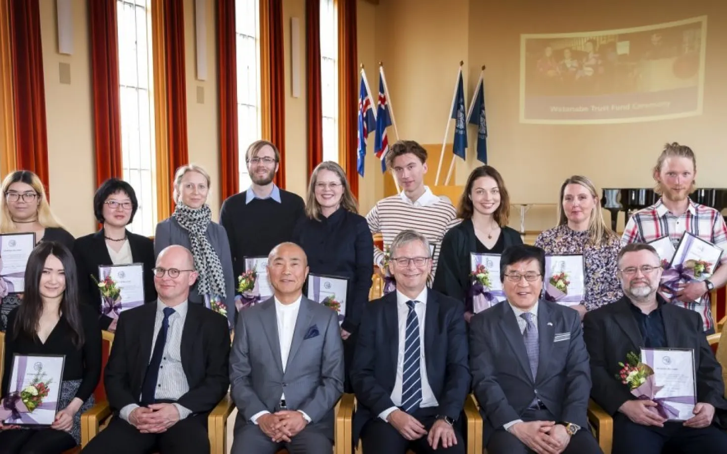 Grantees with Watanabe himself, members of the board, the Ambassador of Japan and Rector of the University of Iceland.