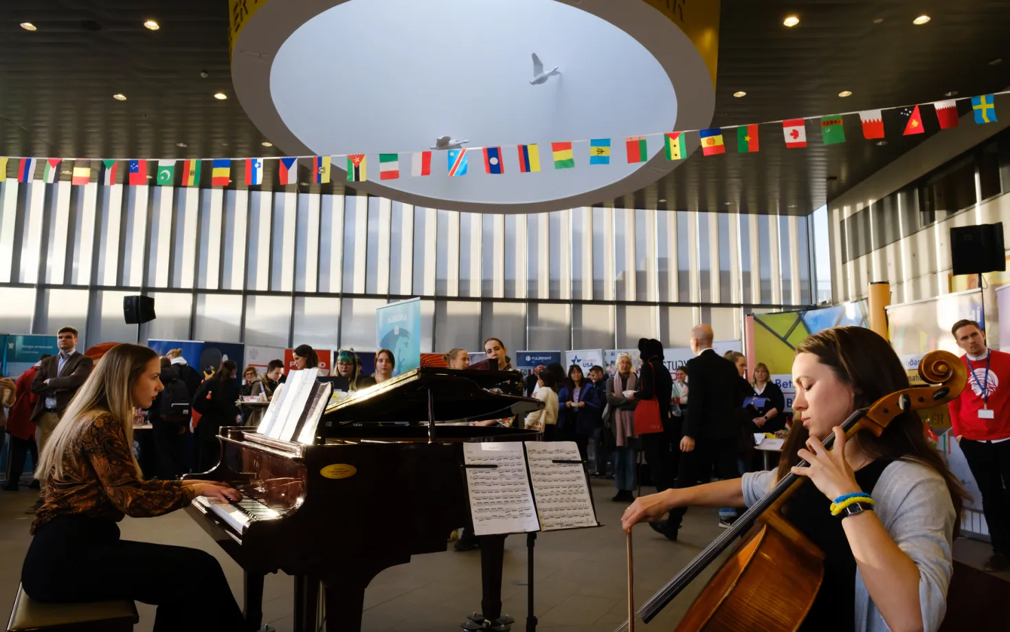 People playing piano and cello at University centre