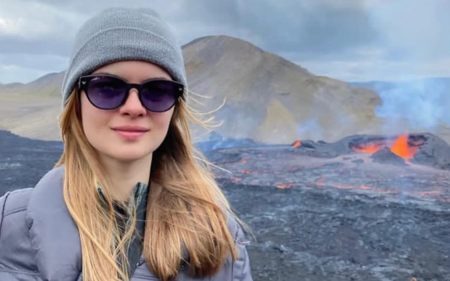 Elif Yaman, volcanic eruption in background