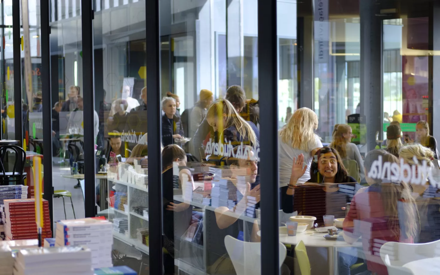 People at University centre, University of Iceland, seen from the University bookstore