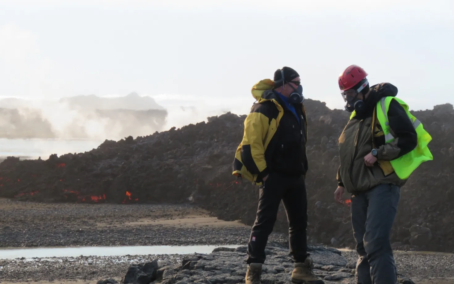 Earth scientists from University of Iceland by a fresh lava