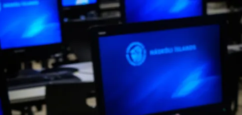 Compurters on a table and UI logo as screensaver