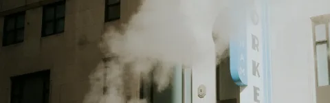 Car in front of house in city