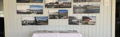 Photos on wall of Breiðdalsvík in past and present