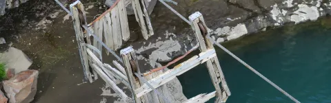 Remains of a cable car crossing a river