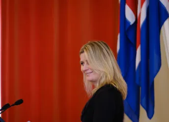 Irma Erlingsdóttir delivering a speech at the meeting.
