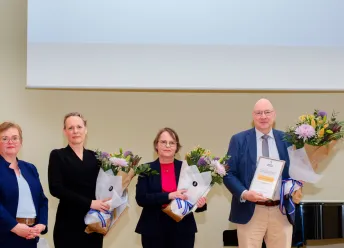Representatives of the environment and natural resources receive the award.