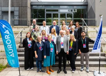 A group of students and staff at the Aurora Annual Conference in Germany.