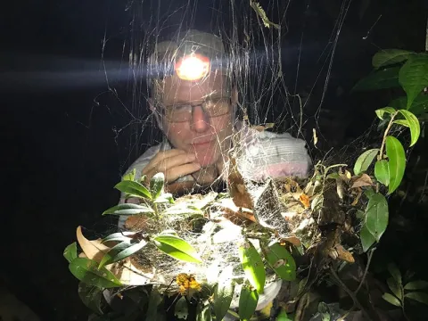 Main with spider web