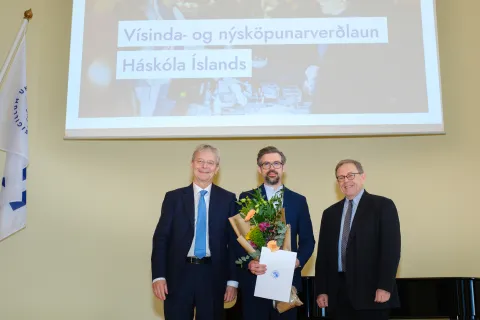 Winner of the competition with the rector and the chairman of the jury