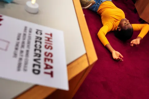 A student performing at the exhibition opening.