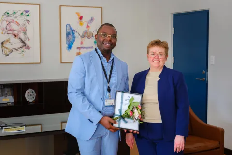 Patrick Kant Muanza and Silja Bára R. Ómarsdóttir, Rector of UI.