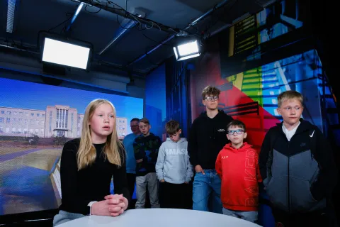Students in the University of Youth in a recording studio.