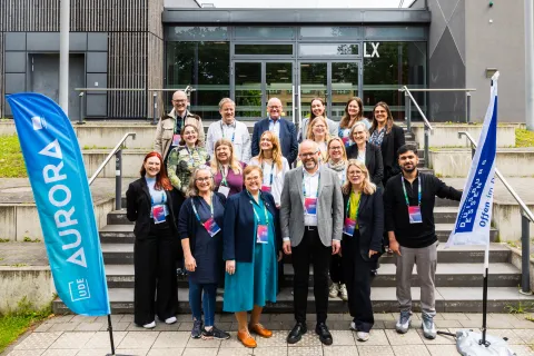 A group of students and staff at the Aurora Annual Conference in Germany.