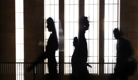 Silhouettes of people inside Main building