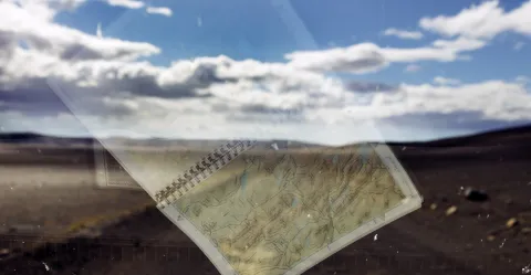 Reflection of a map in a car window