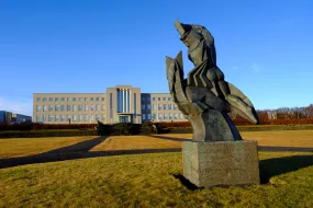 The statue Sæmundur á selnum (Sæmundur on the seal) in front of University of Iceland main building