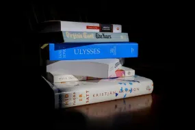 Books in a black background