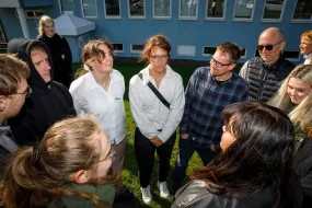 A group of students forming circle 