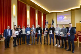 The innovators who received awards for their projects with the University rector and chair of the evaluation committee