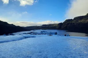 People standing on a glacier.