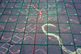 Snakes and ladders on the ground outside