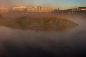 Fog in Vatnsmýri. University of Iceland main building and nearby buildings in the background